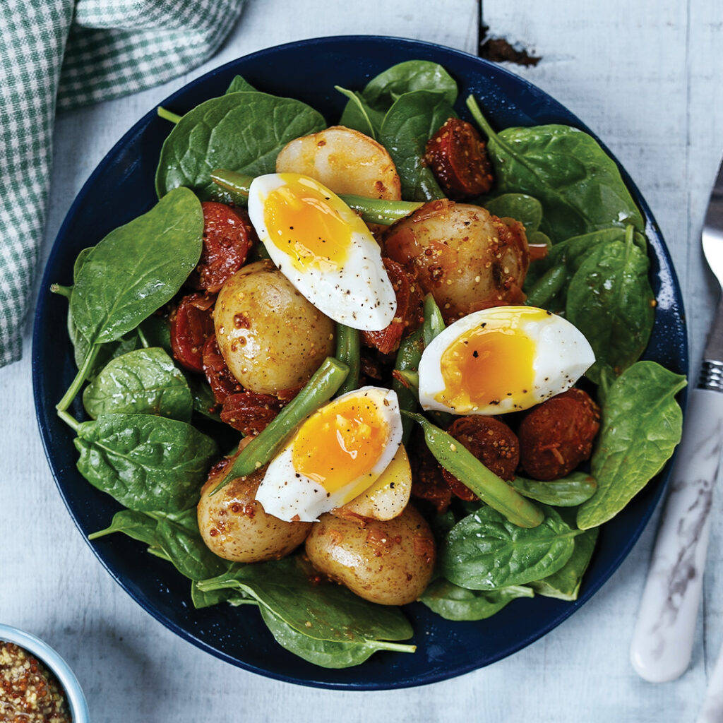 Hard Boiled Eggs With Sausages On A Bed Of Basil Wallpaper