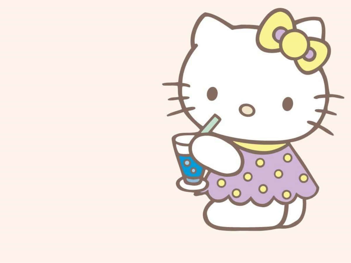 Hello Kitty Laptop Sipping Drink Wallpaper