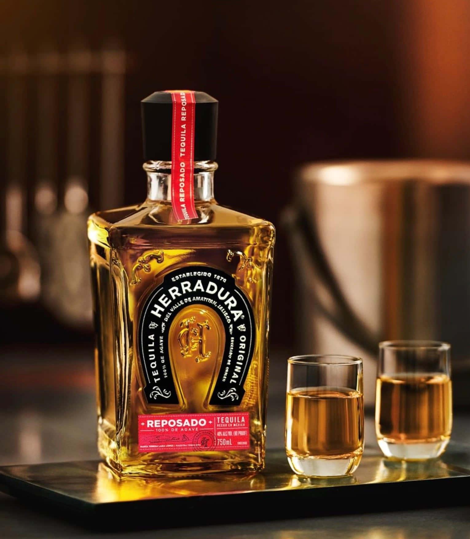 Herradura Reposado Tequila Bottleand Glasses Wallpaper