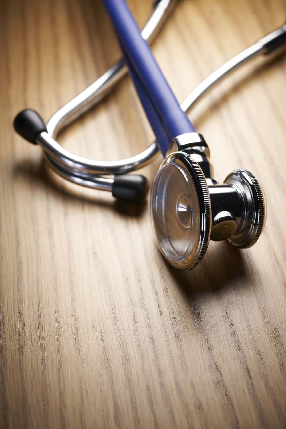 High Definition Image Of A Stethoscope On A Medical Table Wallpaper