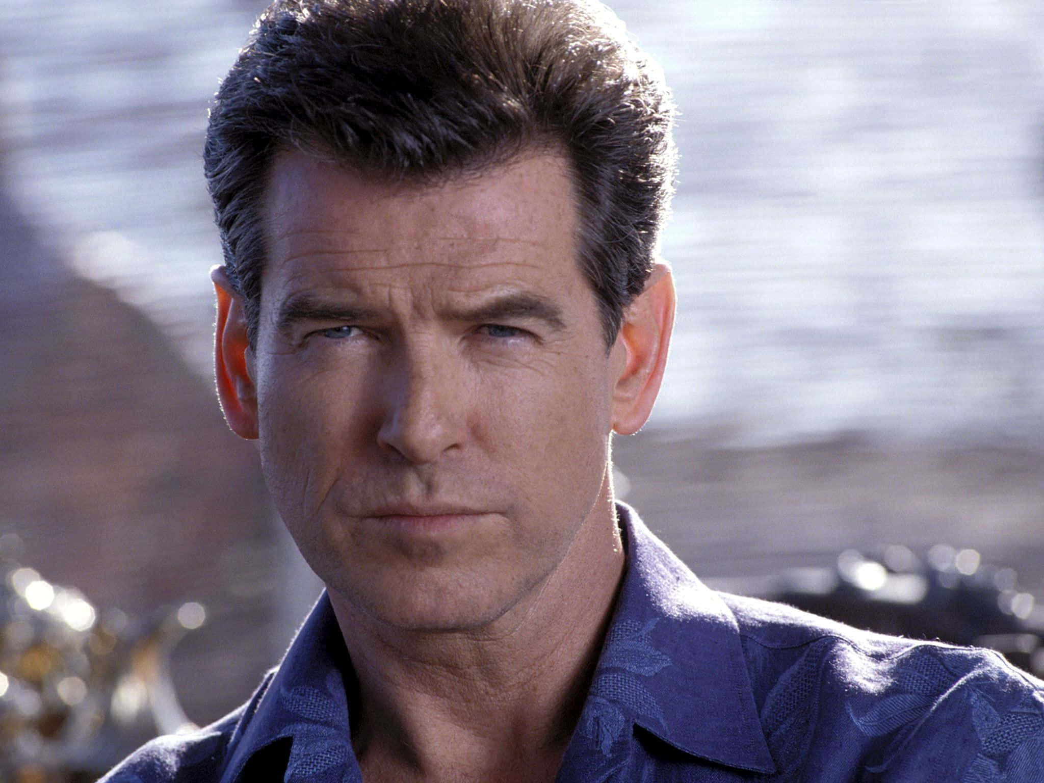 Hollywood Actor Pierce Brosnan In A Suave Pose Wallpaper