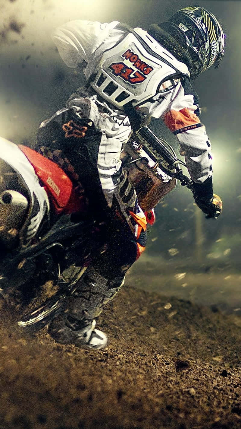 Honda Dirt Bike Riding Through Off Road Wallpaper