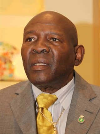 Iconic Boxer Emile Griffith In Elegant Gray Suit Wallpaper