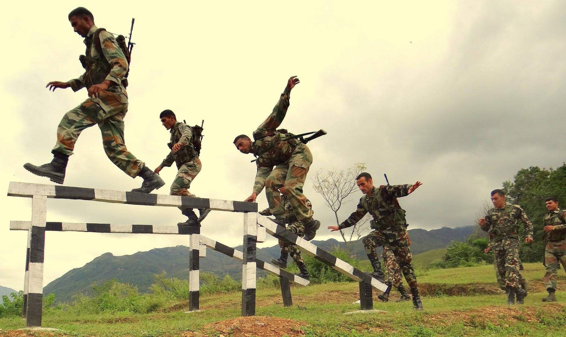Indian Soldiers During Balance Training Wallpaper