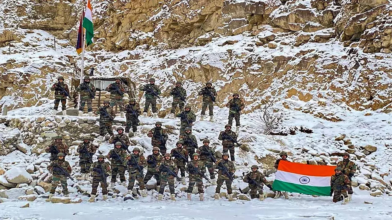 Indian Soldiers Posing With Flag Wallpaper