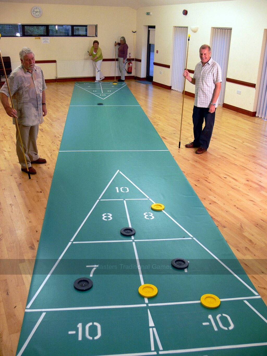 Indoor Shuffleboard Game In Action Wallpaper