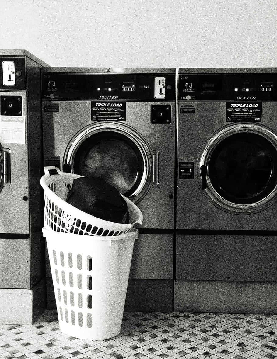 Industrial Laundry Machineswith Basket Wallpaper