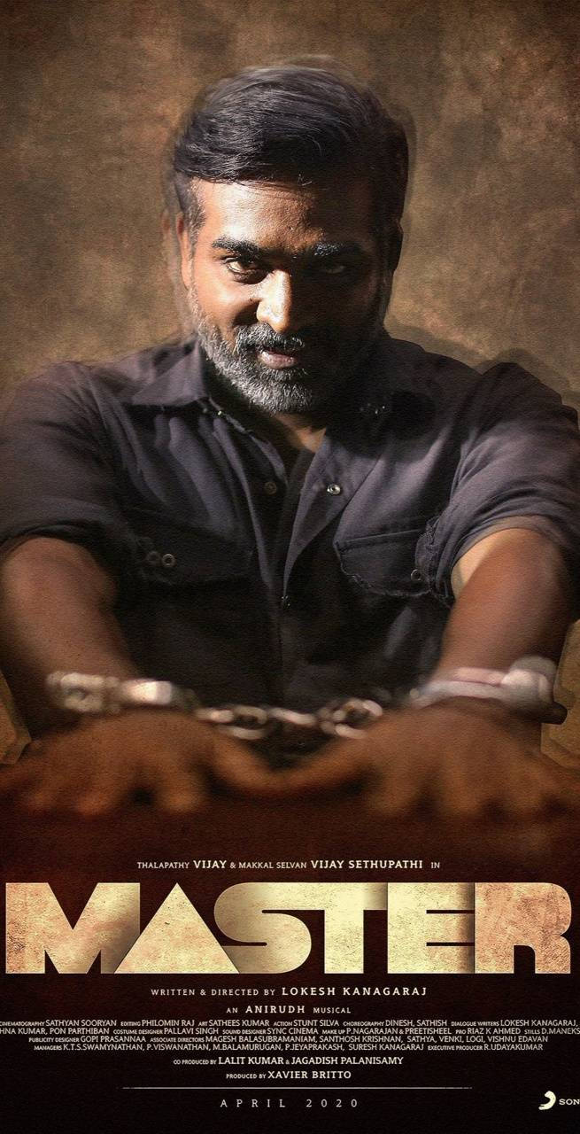Intense Still Of Vijay Sethupathi Handcuffed On A Table From The Movie Master In Hd Wallpaper