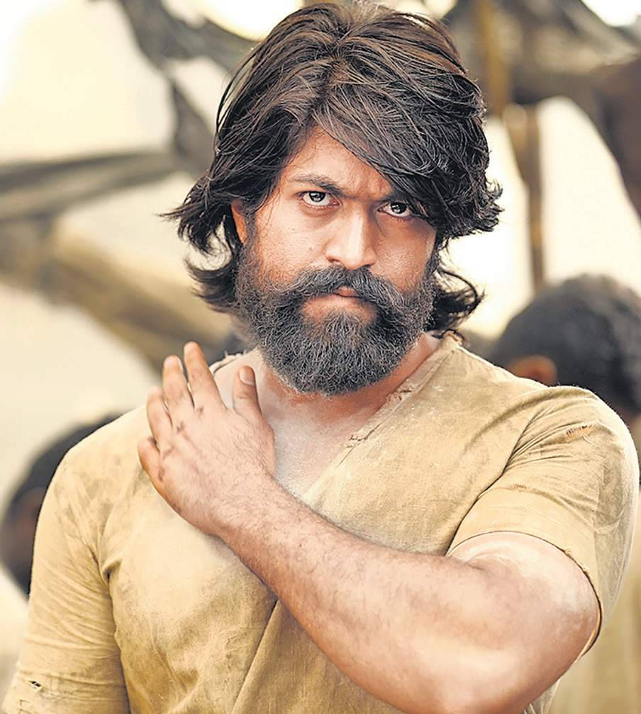 Intriguing Yash In Kgf: With His Iconic Thick Hair And Robust Beard, Capturing The Raw Essence Of His Character. Wallpaper