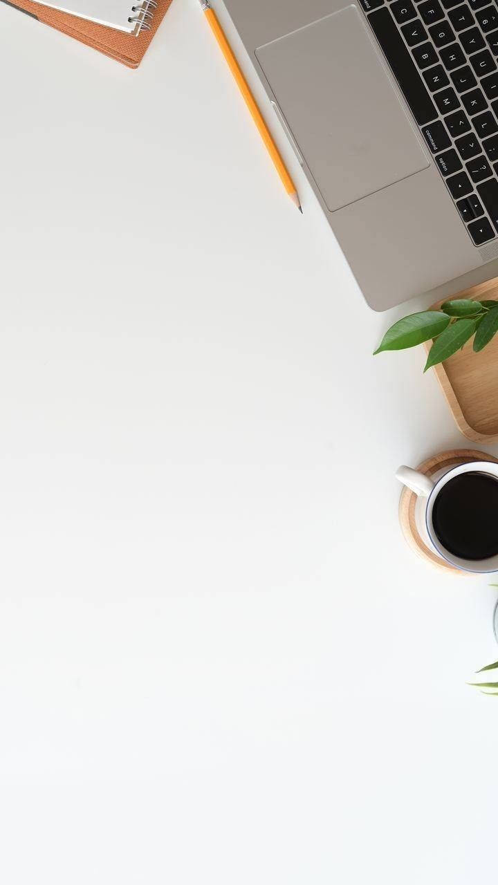 Iphone Desk With White Surface Wallpaper