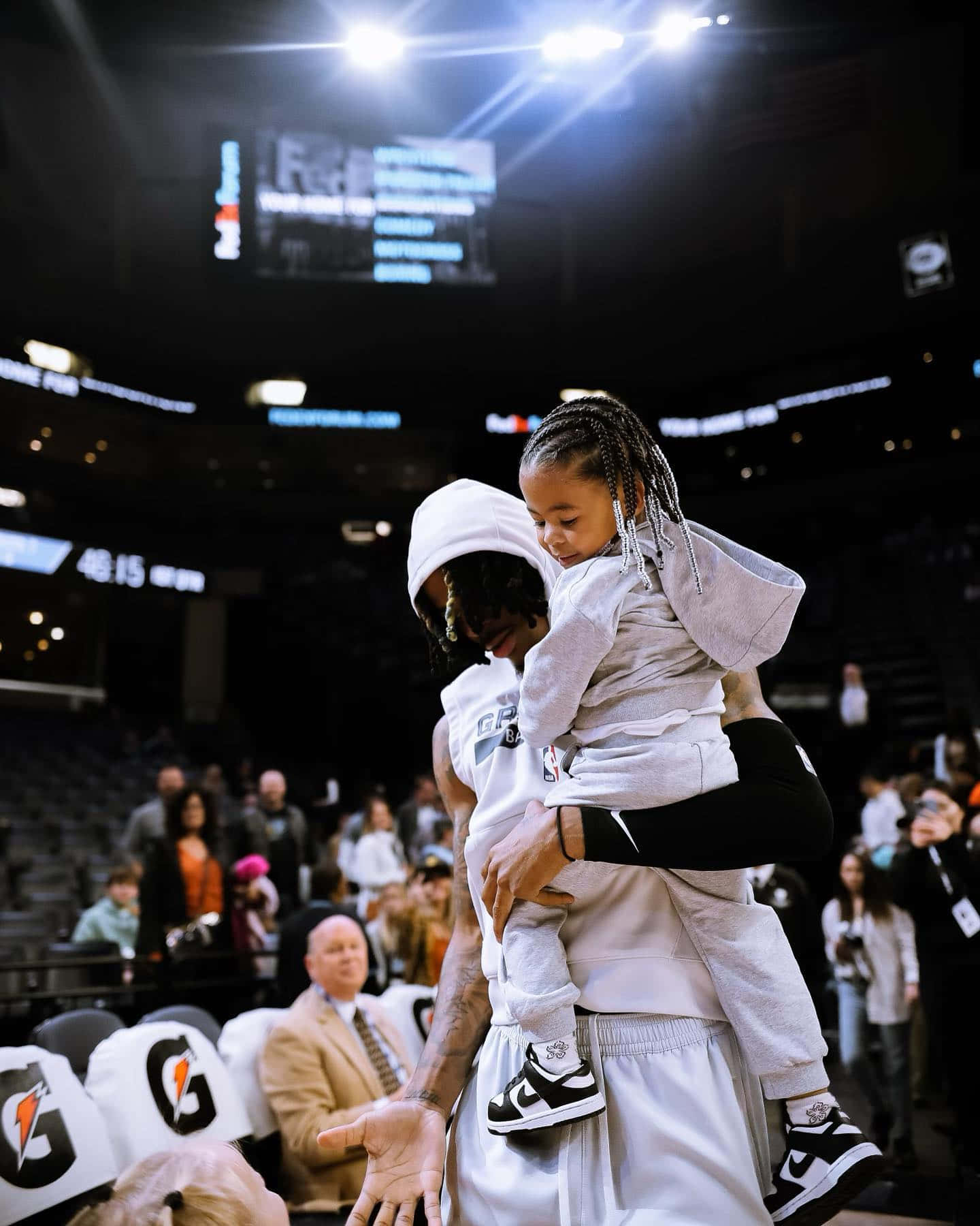 Ja Morrant Holding His Child Wallpaper