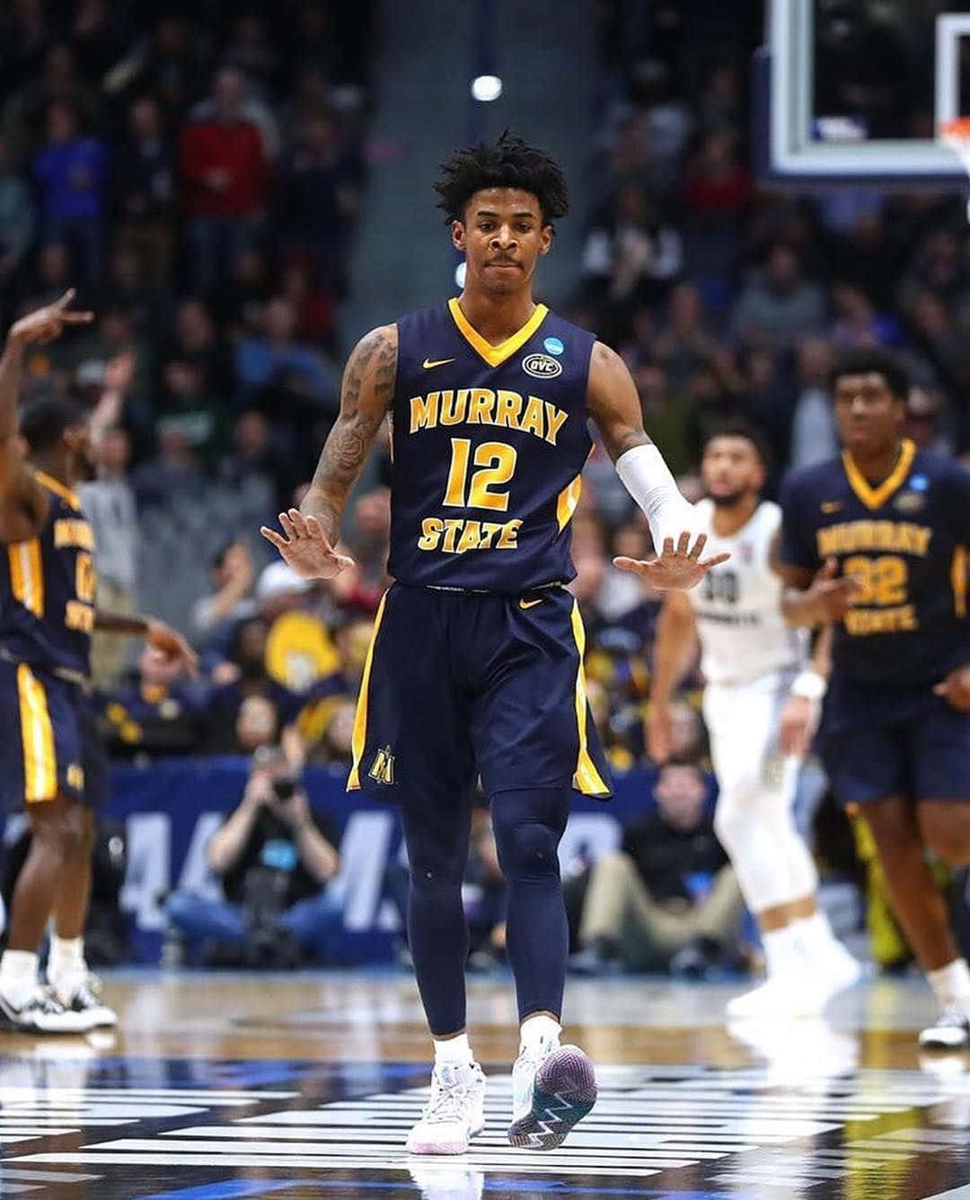 Ja Morrant In Dark Blue Jersey Wallpaper