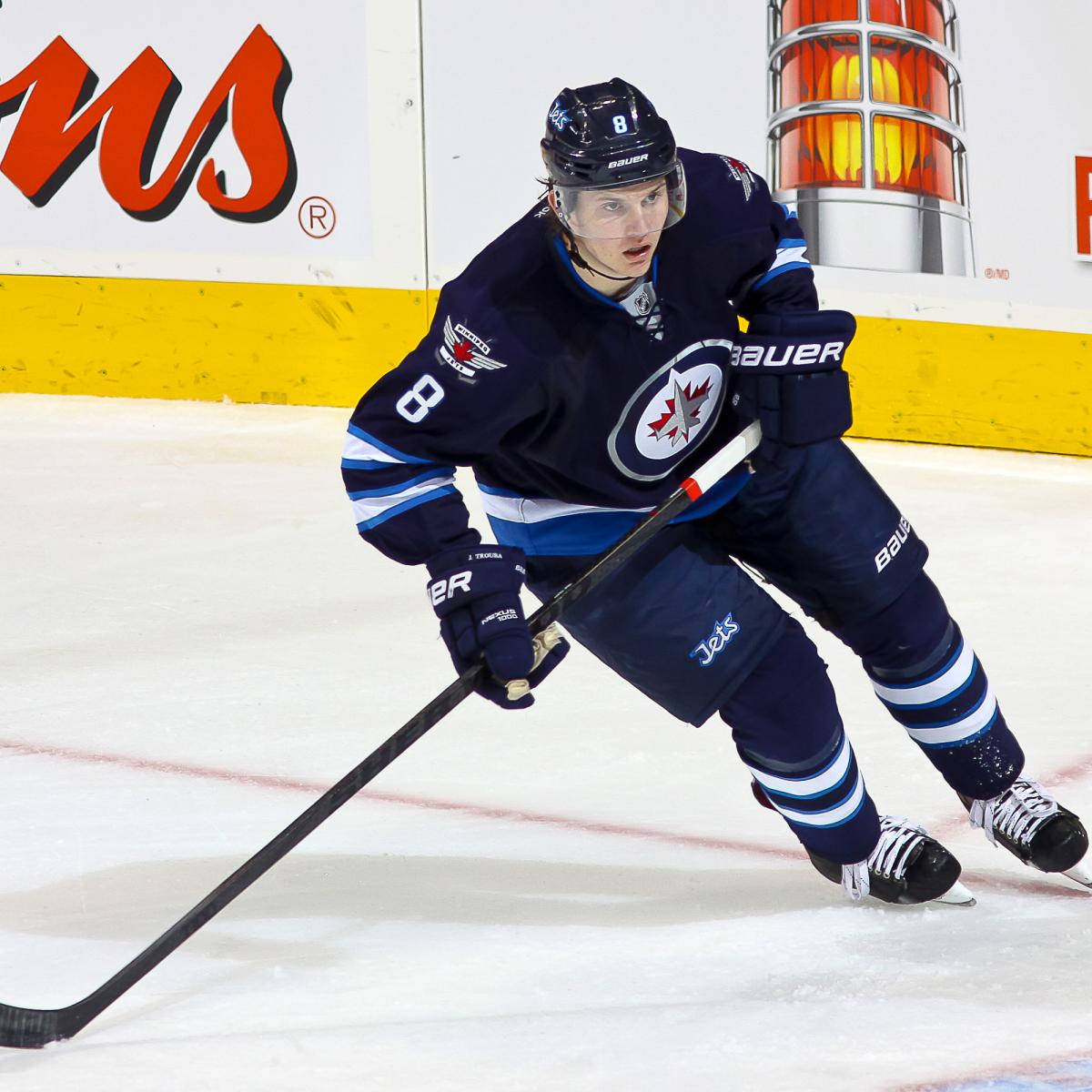 Jacob Trouba Leaning To The Right While Holding Hockey Stick Wallpaper