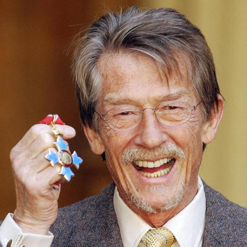 John Hurt Holding Flower Trinket Wallpaper