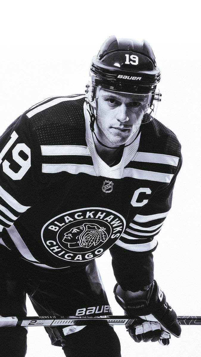 Jonathan Toews In Action - Ice Hockey Champion And No. 19 Player For The Blackhawks Wallpaper