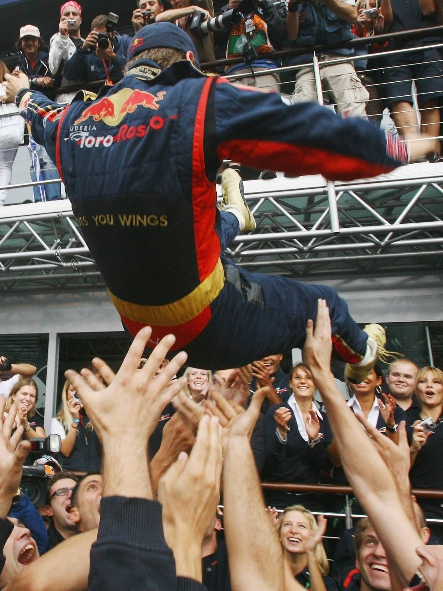 Joyful Moment: Sebastian Vettel Celebrated By His Team Wallpaper