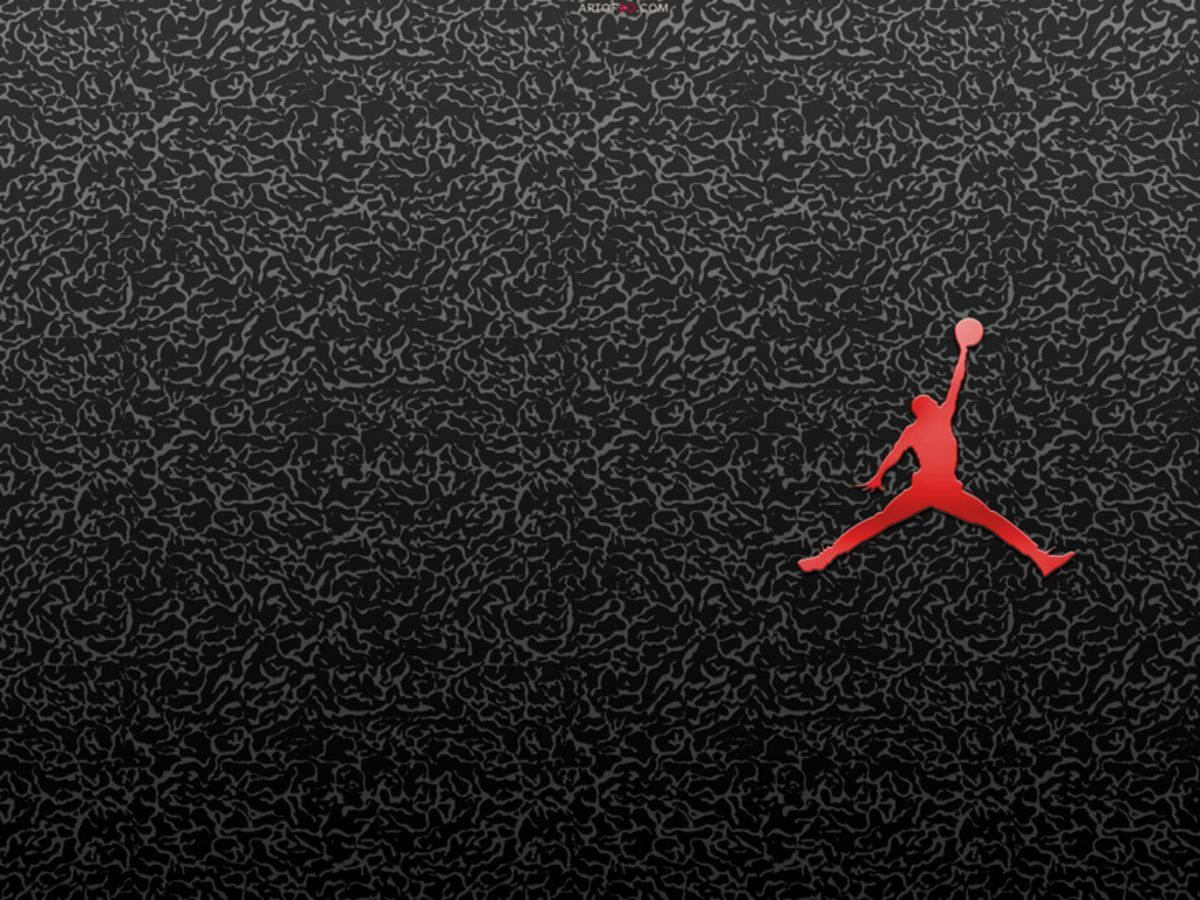 Jump To Victory With The Air Jordan Basketball Logo Wallpaper