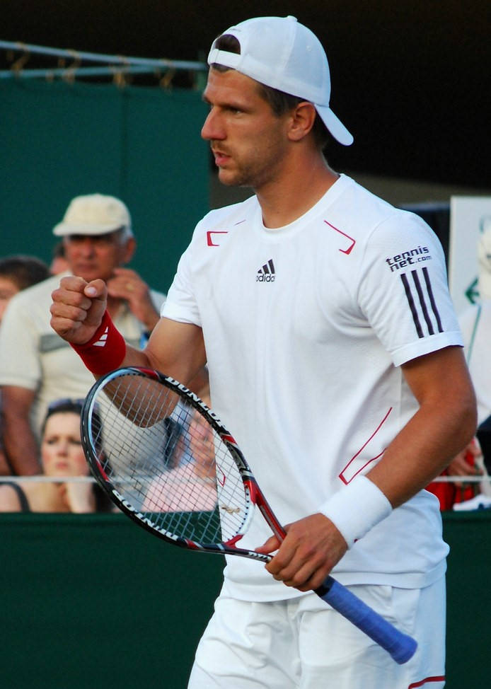 Jurgen Melzer Fist Pump While Holding Racket Wallpaper