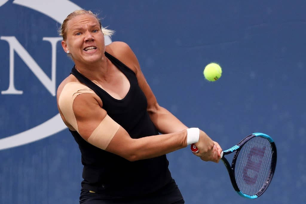 Kaia Kanepi In Action During A Tennis Match Wallpaper