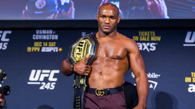 Kamaru Usman Holding His Ufc Belt In Triumph Wallpaper