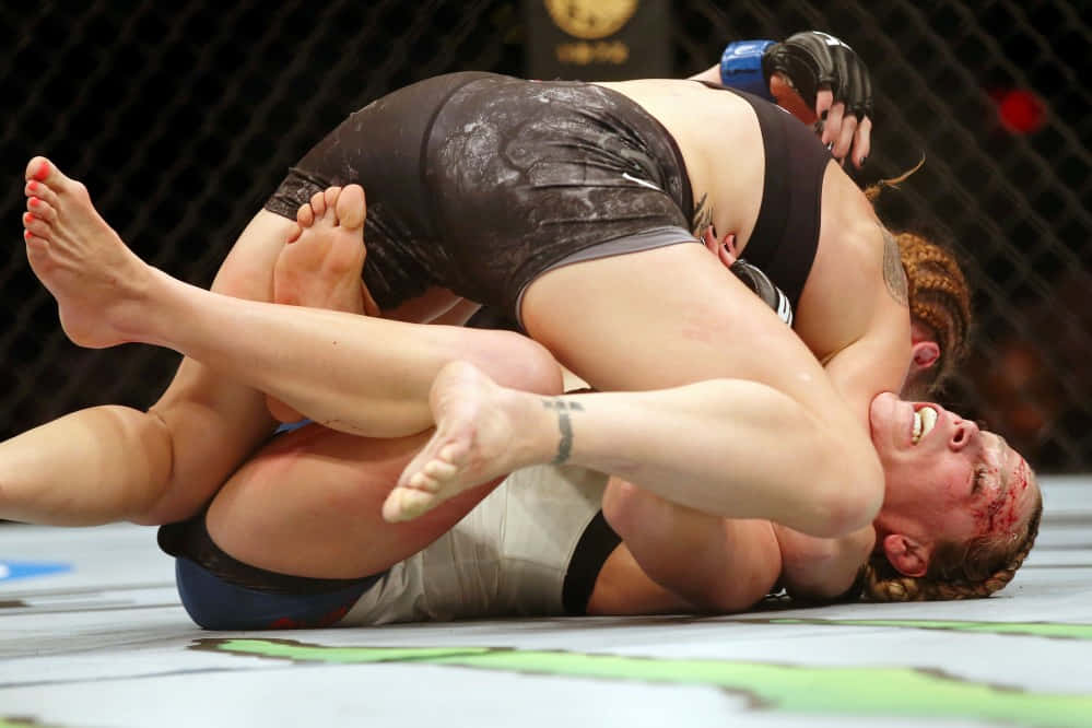 Katlyn Chookagian Tackled By Opponent Wallpaper