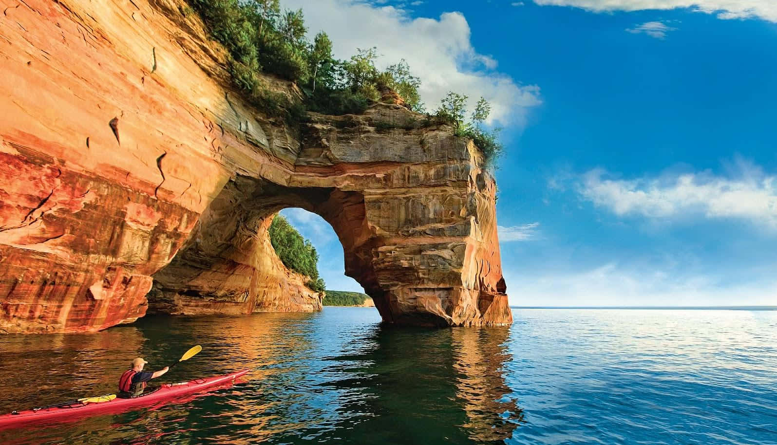 Kayaking Under Natural Arch Wallpaper