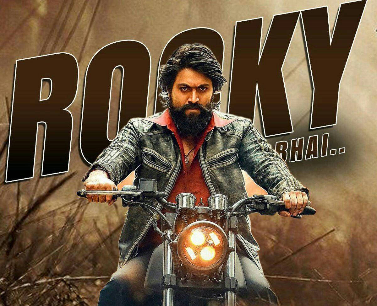 Kgf Rocky Bhai Riding Motorcycle Wallpaper