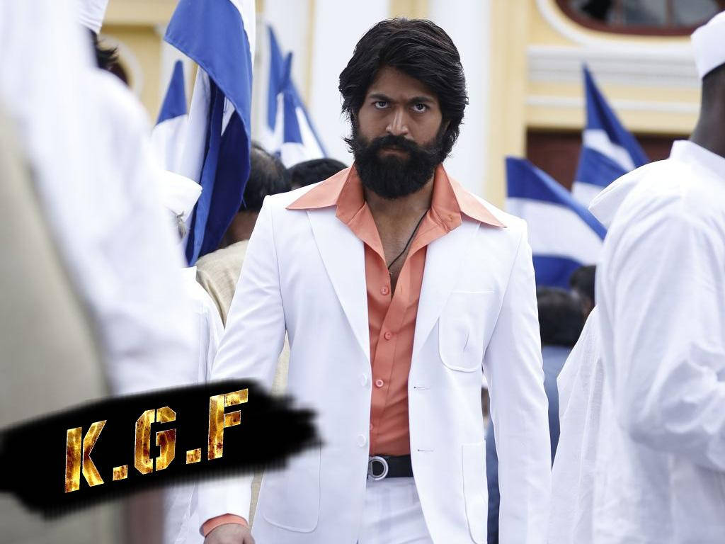 Kgf Rocky In White And Pink Suit Wallpaper