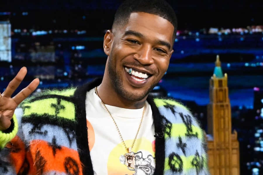Kid Cudi Peace Sign T V Show Appearance Wallpaper