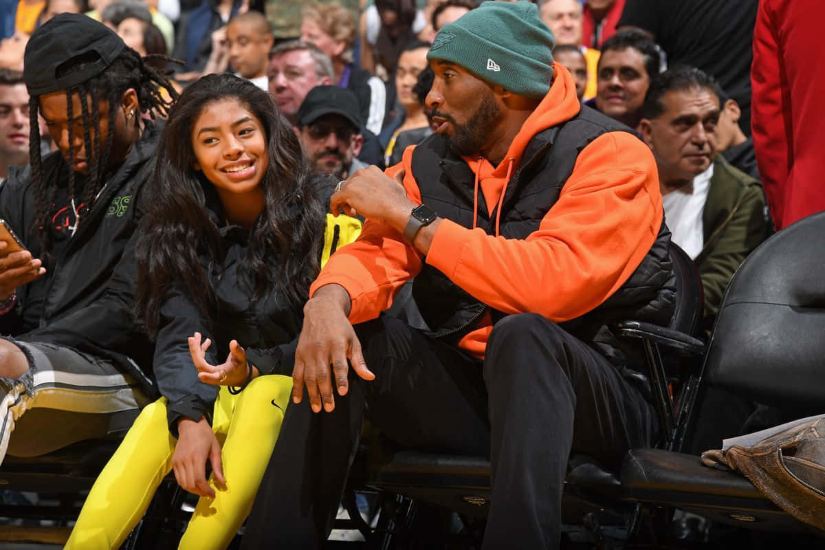 Kobe And Gianna Bryant Celebrating A Lakers Victory Wallpaper