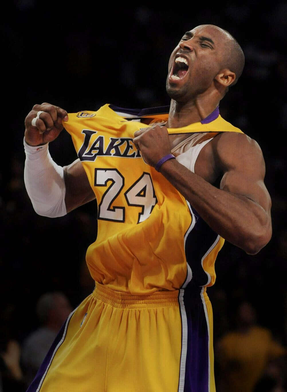 Kobe Bryant Basketball Showing Off Lakers Jersey Wallpaper