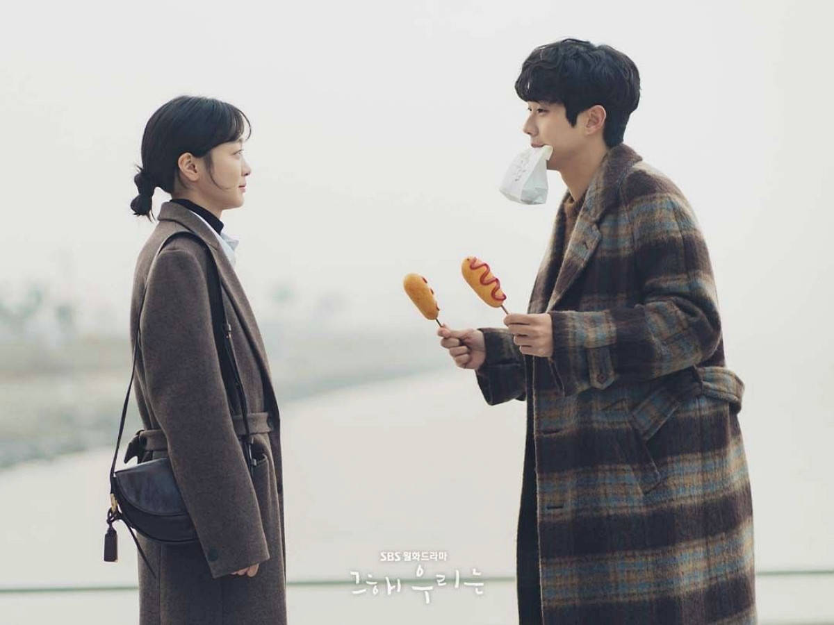 Korean Actor Choi Woo Shik Enjoying A Corndog Date Wallpaper