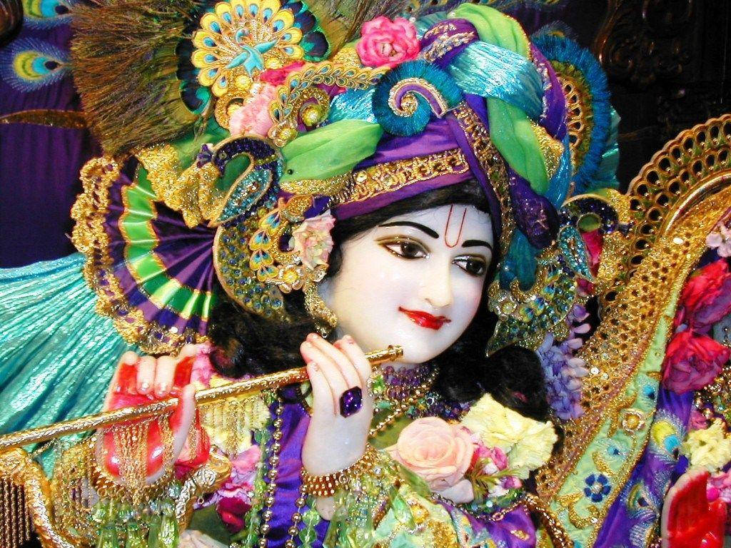 Krishna Ji With Colorful Garments Wallpaper