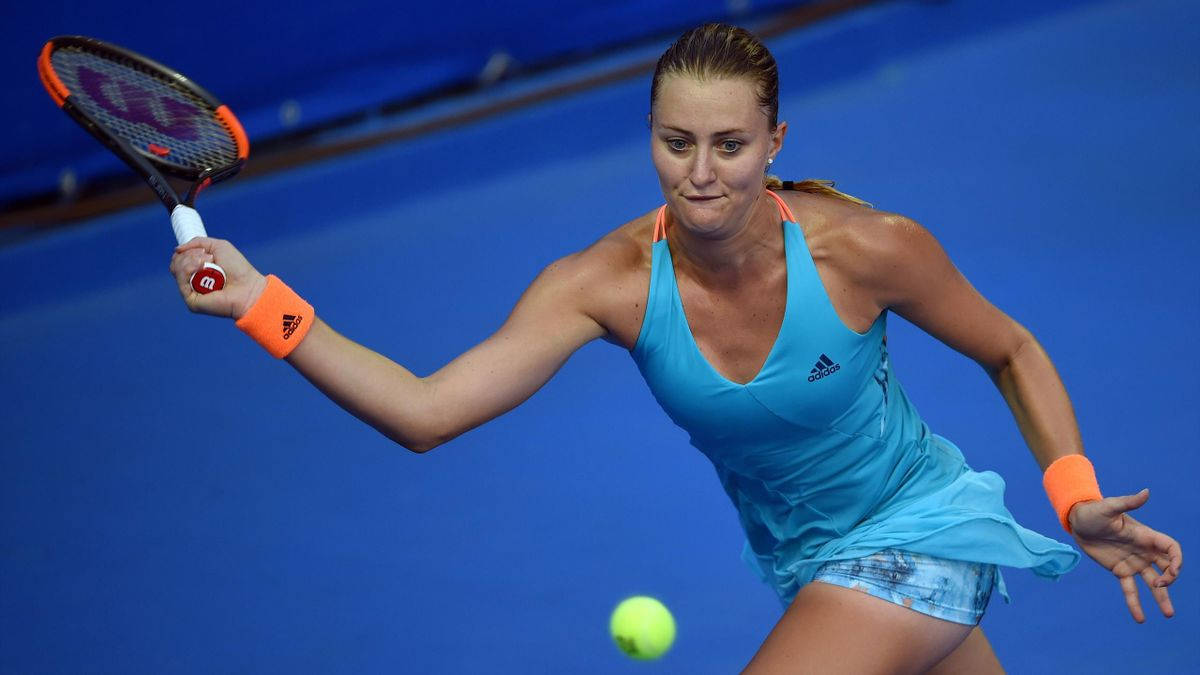 Kristina Mladenovic Striking The Ball Wallpaper