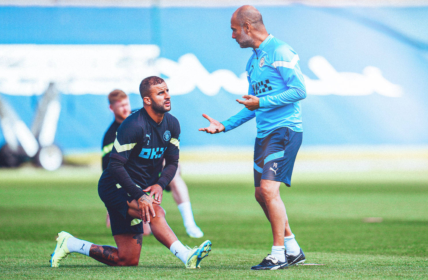 Kyle Walker Talking To Pep Guardiola Wallpaper