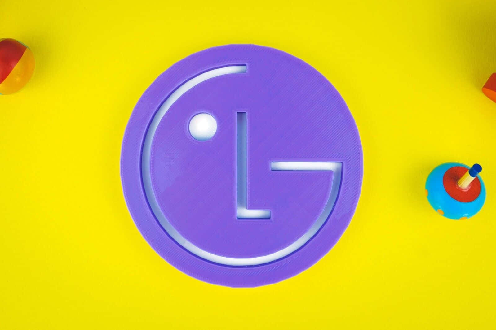 L G Logo Purpleon Yellow Background Wallpaper