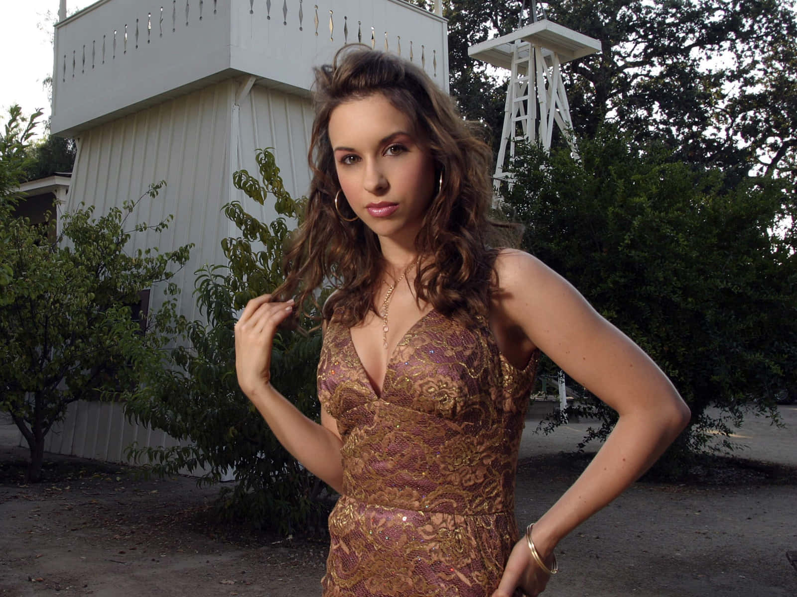 Lacey Chabert Posing Elegantly In A Lace Dress Wallpaper