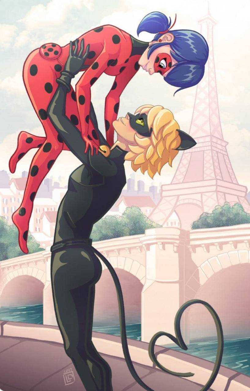 Ladybug And Cat Noir Kiss In Paris Wallpaper