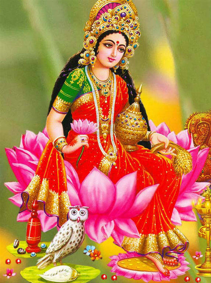 Lakshmi Devi Holding Rice Grains Wallpaper