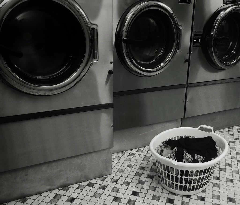 Laundromat Washing Machinesand Basket Wallpaper