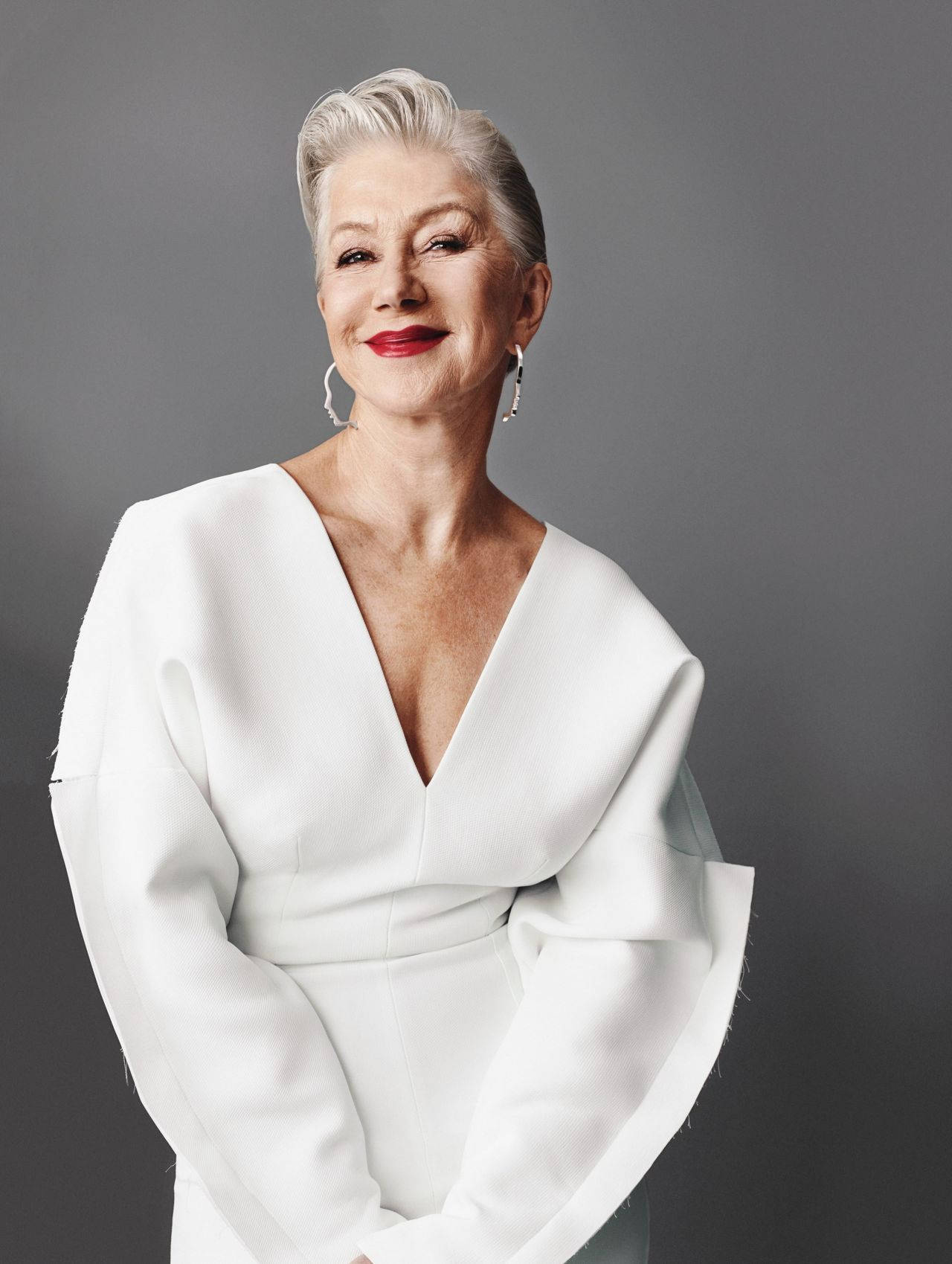 Legendary Actress Helen Mirren Posing Elegantly In A Professional Studio Photoshoot Wallpaper