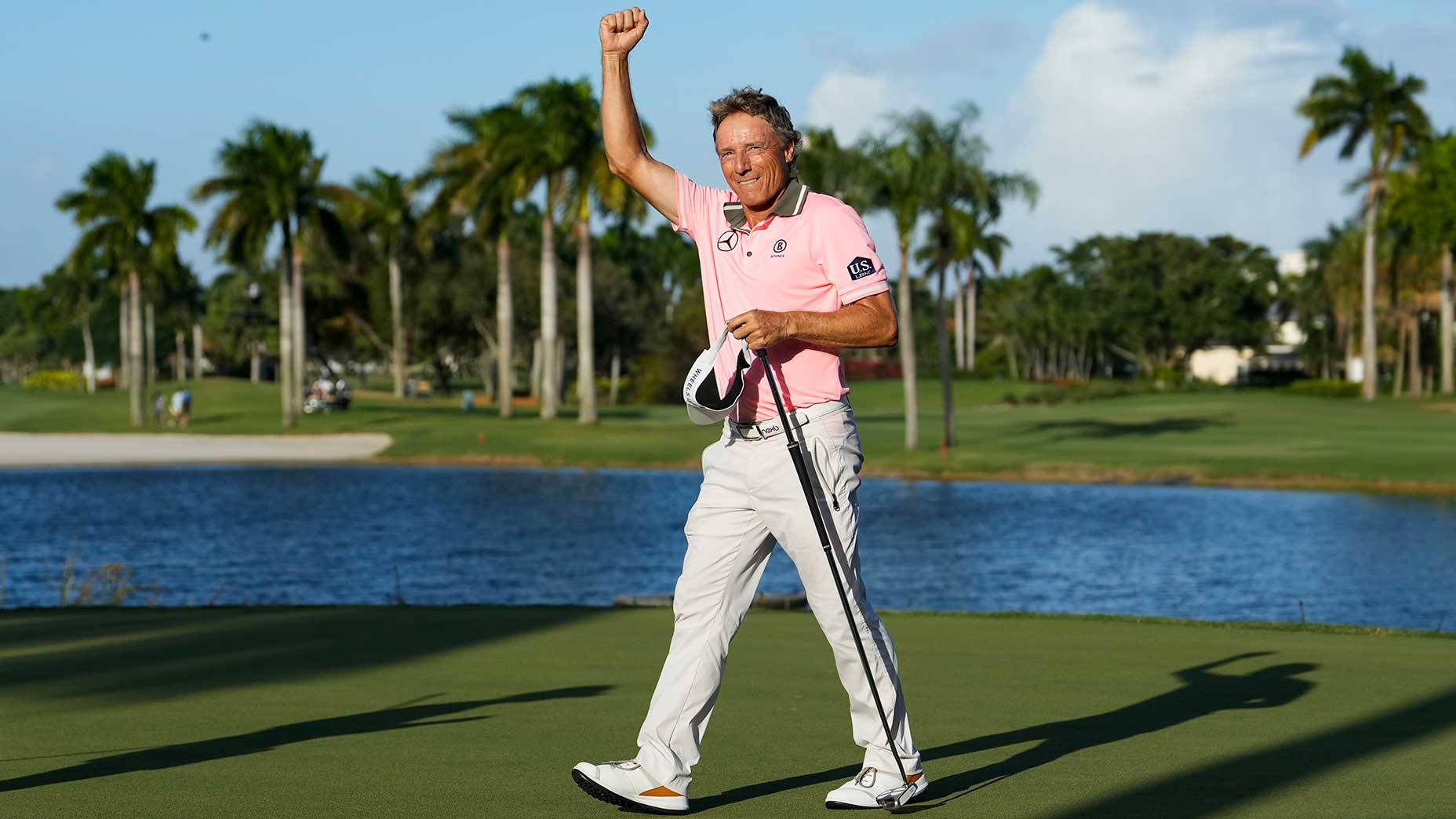 Legendary Golfer Bernhard Langer Celebrating With A Raised Hand Wallpaper