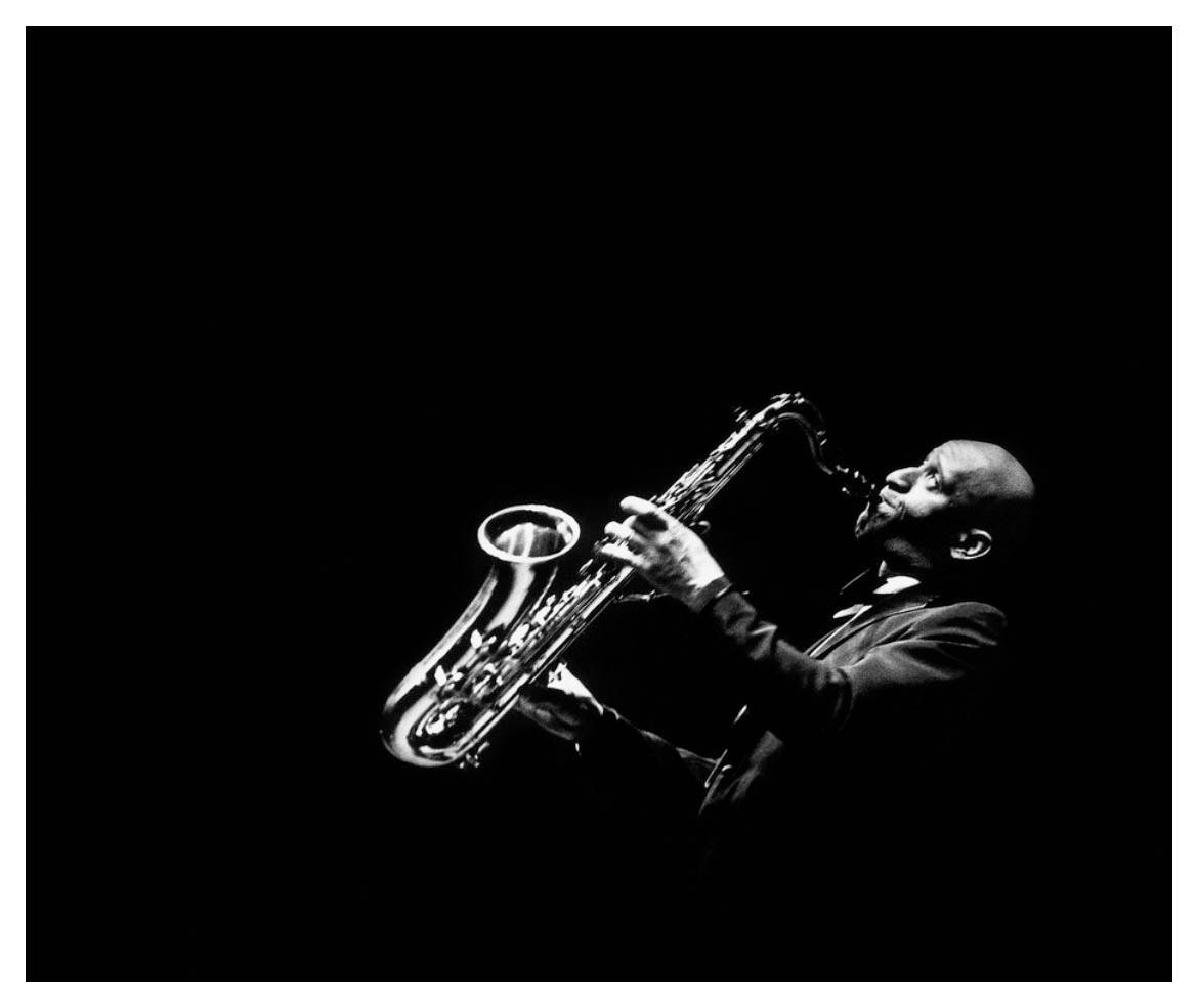 Legendary Jazz Saxophonist Sonny Rollins In Performance Wallpaper