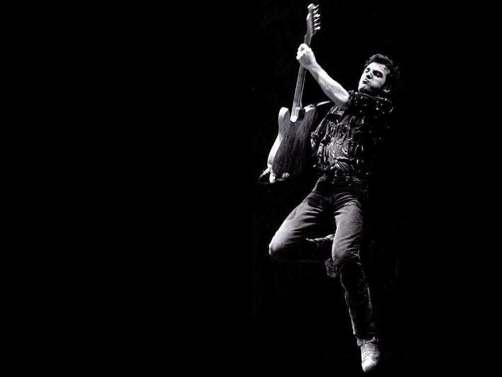 Legendary Rock Icon Bruce Springsteen On Stage Wallpaper