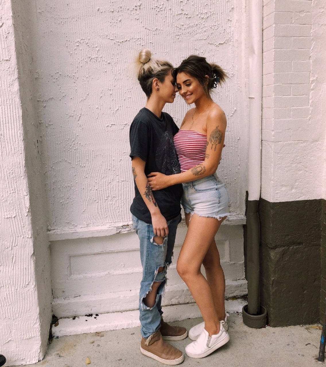 Lesbian Girl In Front Of Wall Wallpaper