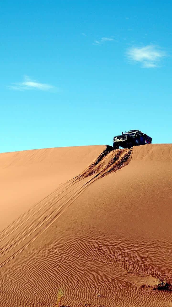 Lg G4 Jeep Over A Sand Dune Wallpaper