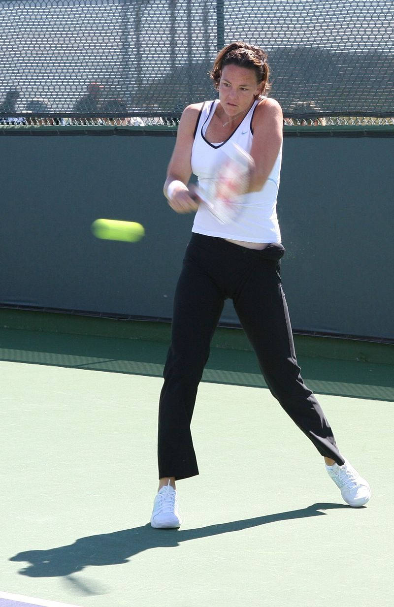 Lindsay Davenport Powerfully Hitting A Tennis Ball Wallpaper