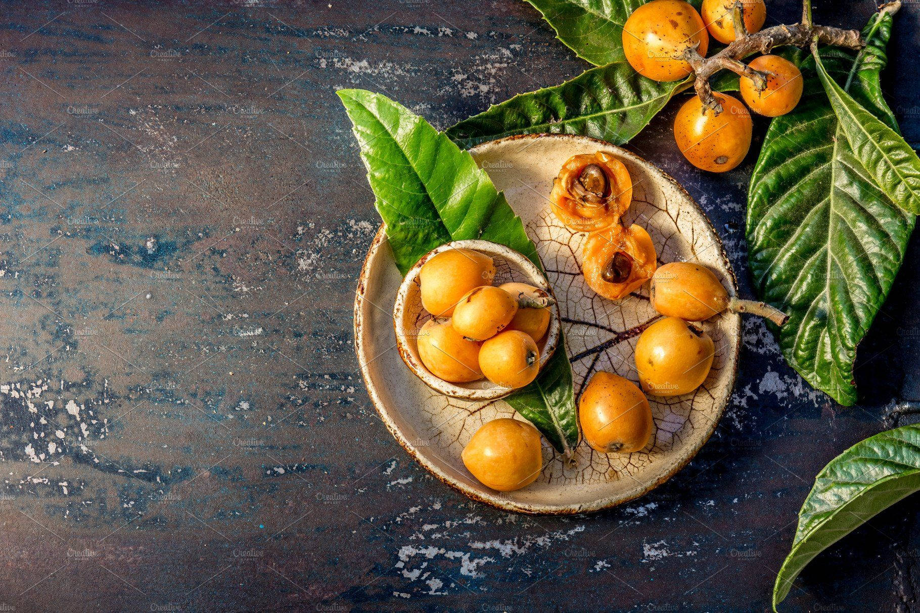 Loquat Fruit On Wooden Plate Wallpaper