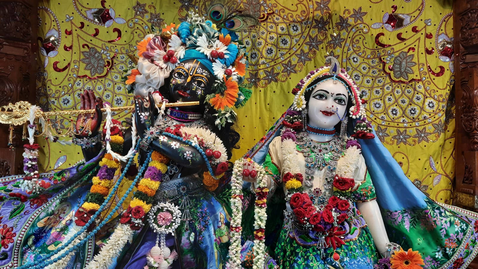 Lord Krishna And Radha Rani In Iskcon Temple Wallpaper