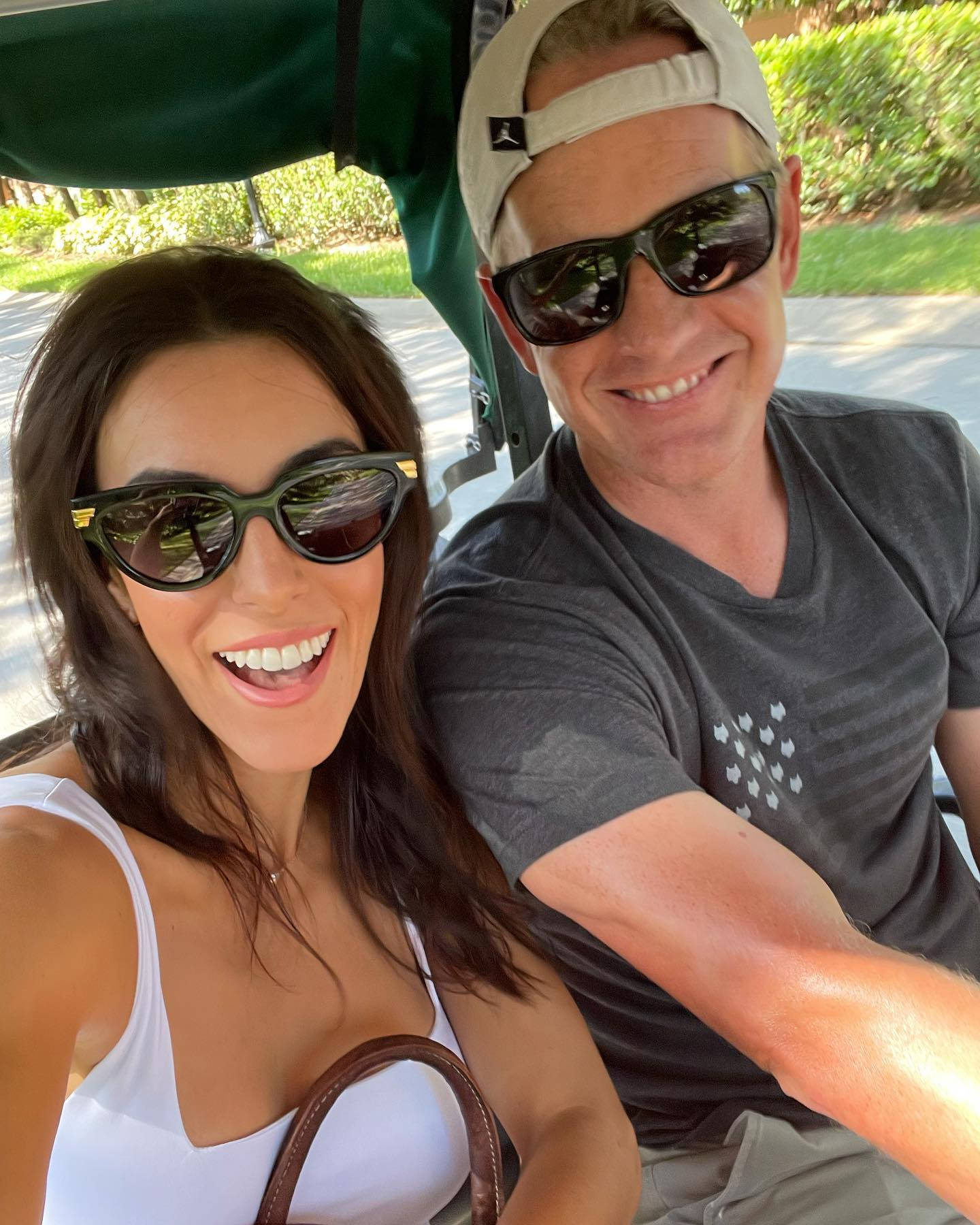 Luke Donald And Wife Riding Cart Wallpaper